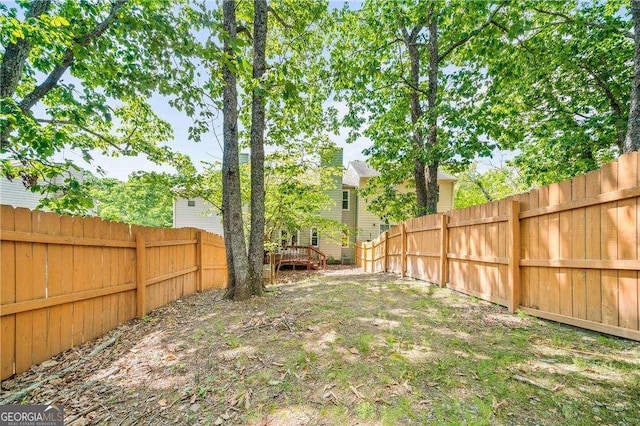 view of yard featuring a wooden deck