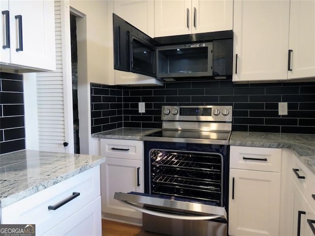 kitchen featuring white cabinetry and stainless steel range with electric cooktop