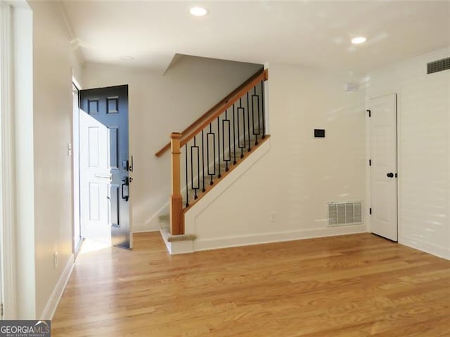 foyer entrance with light wood-type flooring