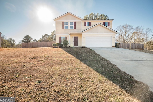 view of front property with a garage and a front lawn