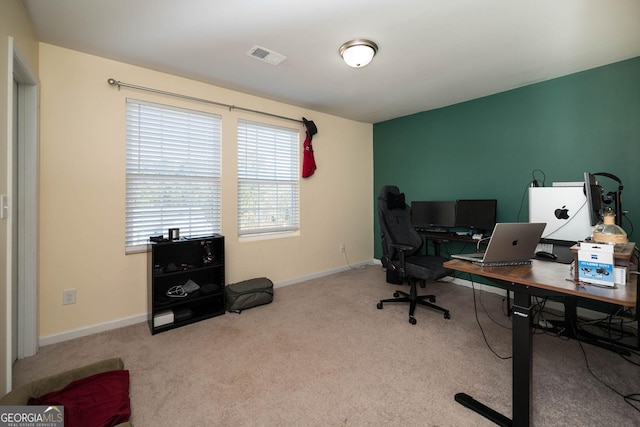 carpeted office featuring baseboards and visible vents