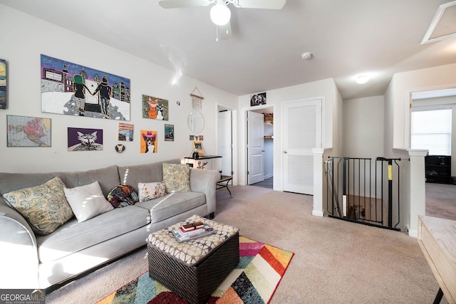 living room with carpet and a ceiling fan