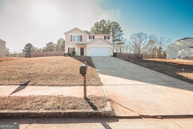 traditional-style house with concrete driveway, an attached garage, and fence