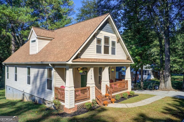 view of front of property with a front lawn and a porch