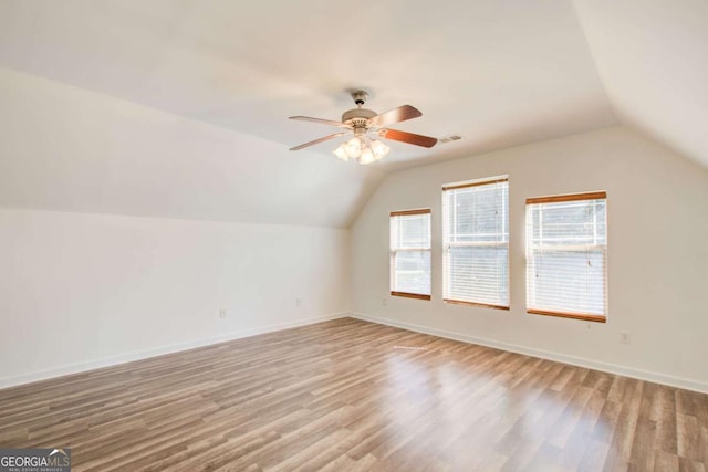 bonus room featuring ceiling fan, lofted ceiling, and light wood-type flooring