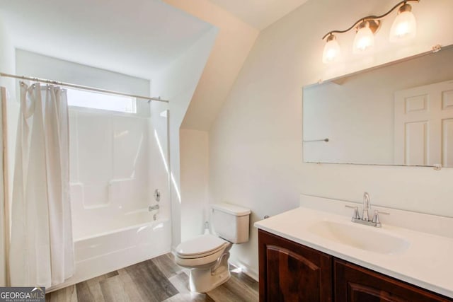 full bathroom featuring hardwood / wood-style floors, vanity, toilet, and shower / bathtub combination with curtain