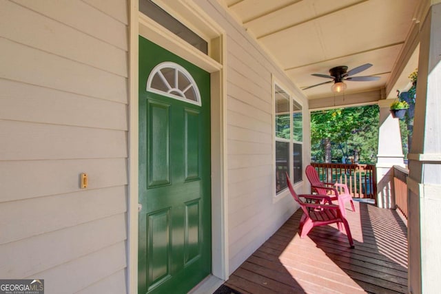 property entrance with a porch and ceiling fan