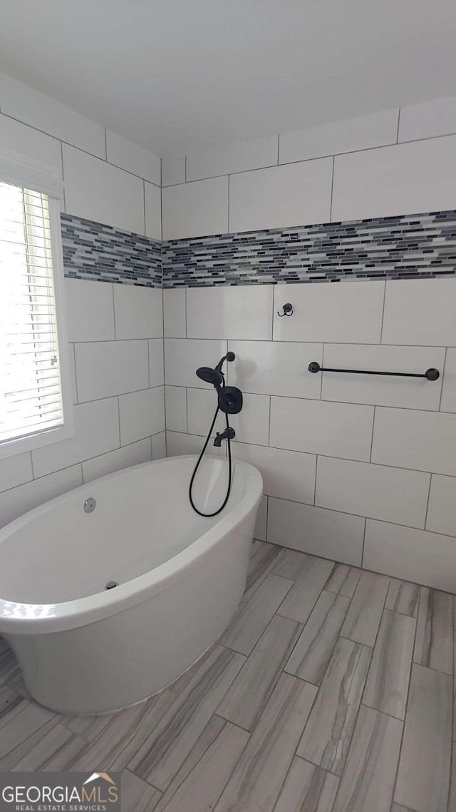 bathroom featuring a washtub