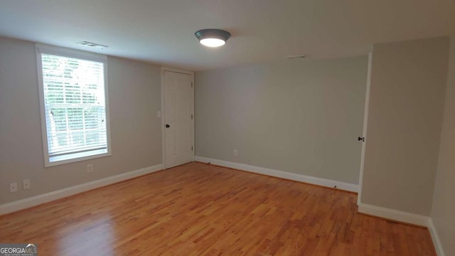 empty room with light wood-type flooring