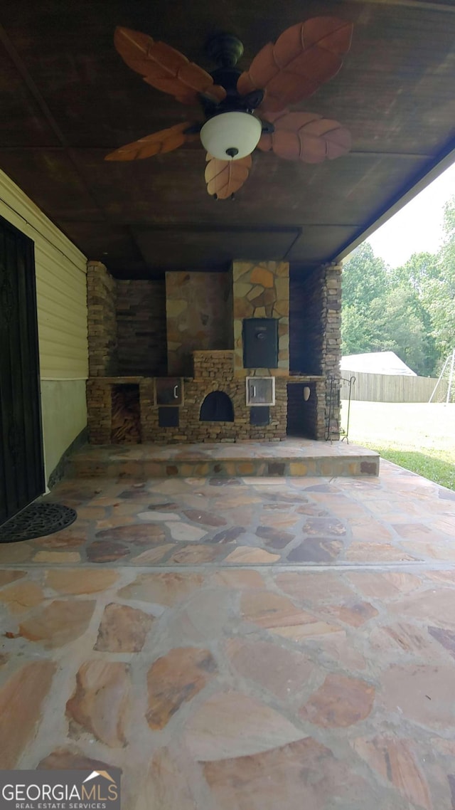 view of patio featuring ceiling fan