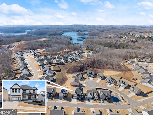 bird's eye view with a residential view and a water view