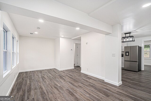 unfurnished room with dark hardwood / wood-style floors