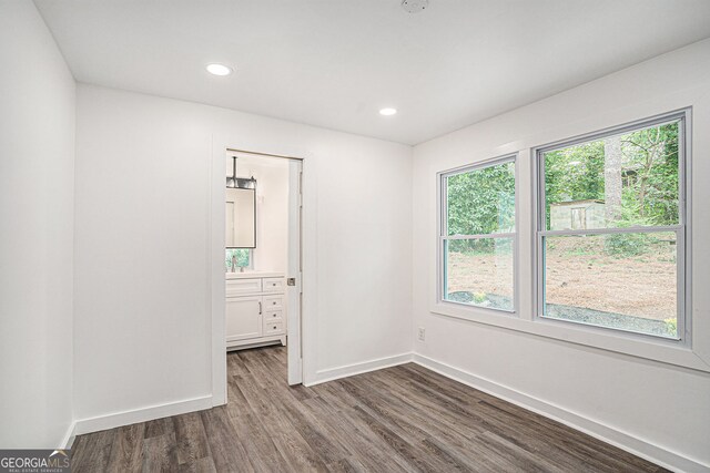 empty room featuring dark hardwood / wood-style flooring