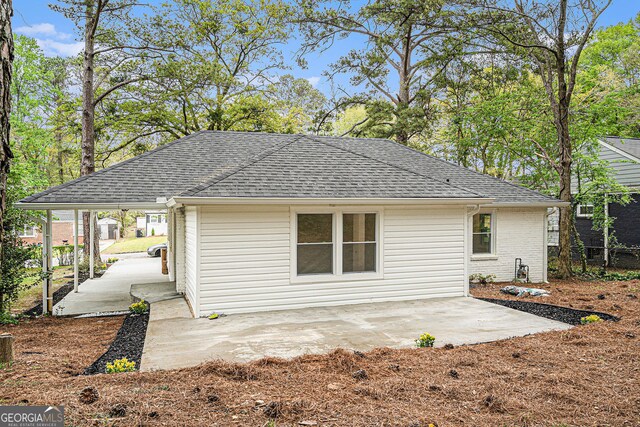 view of property exterior with a patio