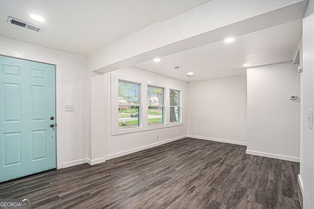 entrance foyer with dark hardwood / wood-style floors