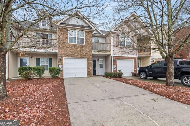 townhome / multi-family property featuring a garage