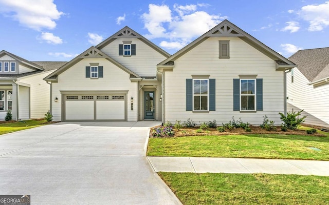 view of front facade with a front yard and a garage