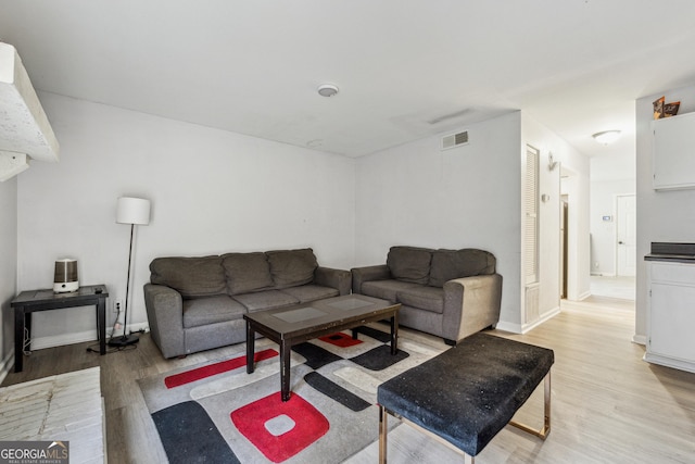 living room with light hardwood / wood-style flooring