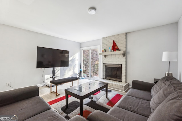 living room with wood-type flooring and a fireplace