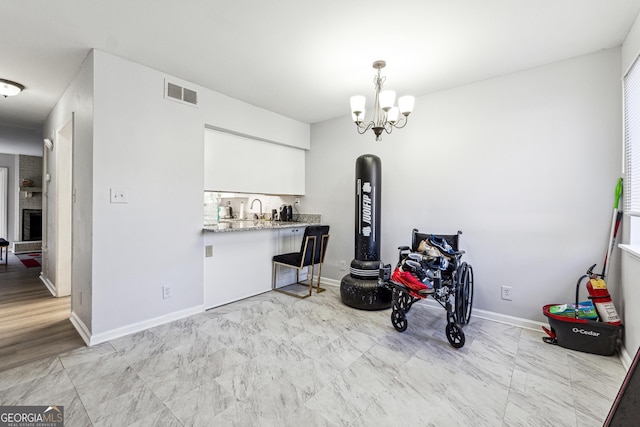 interior space with sink and a chandelier