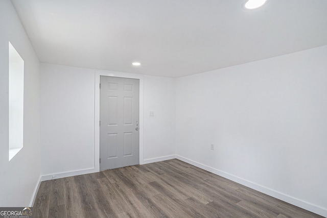 spare room with hardwood / wood-style flooring