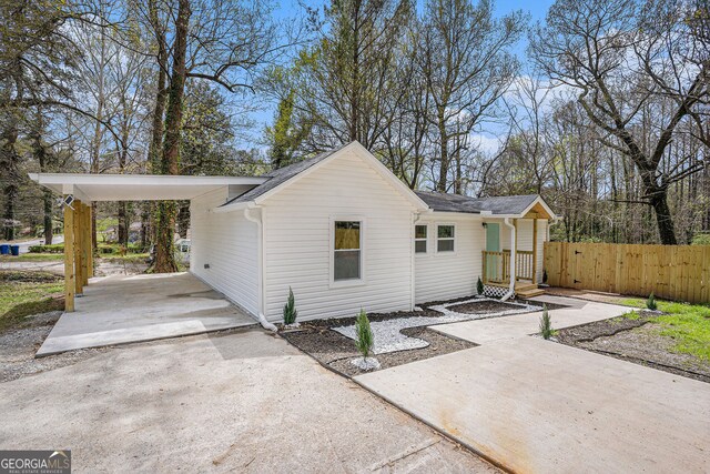 view of front of home featuring a carport