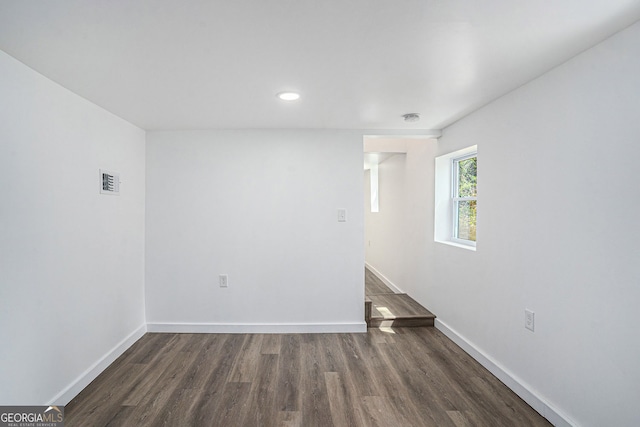 unfurnished room featuring dark hardwood / wood-style floors