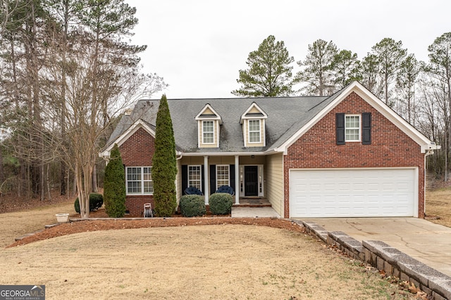 view of front of property featuring a porch and a garage