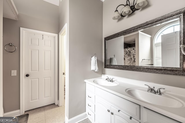 bathroom with tile patterned floors, vanity, and a shower with curtain