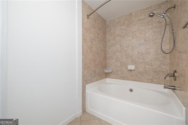 bathroom with tile patterned flooring and tiled shower / bath combo