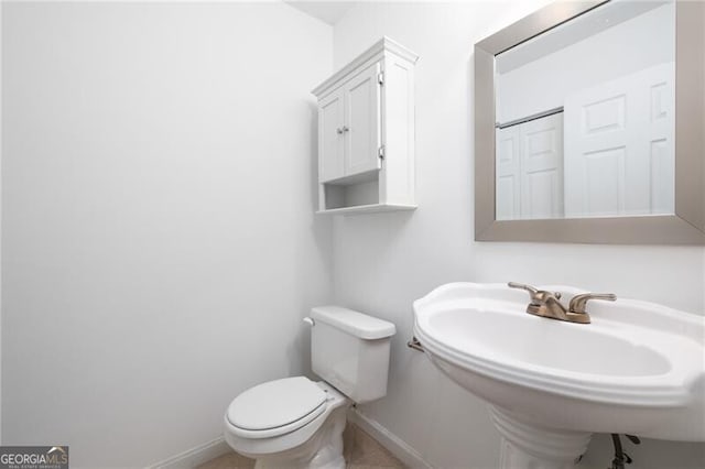 bathroom with sink and toilet