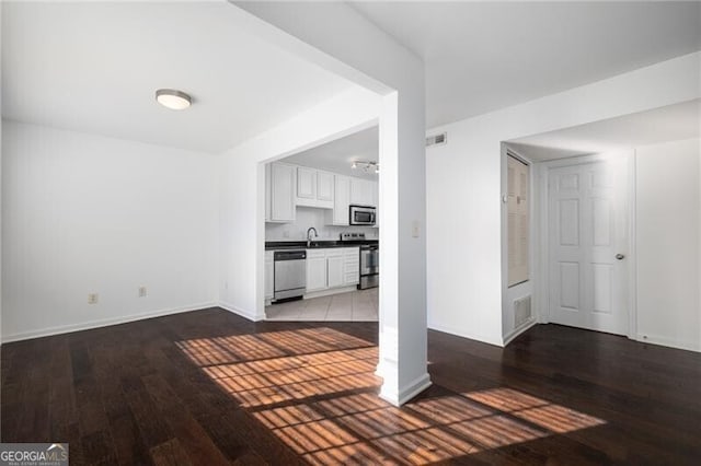 unfurnished living room featuring wood-type flooring