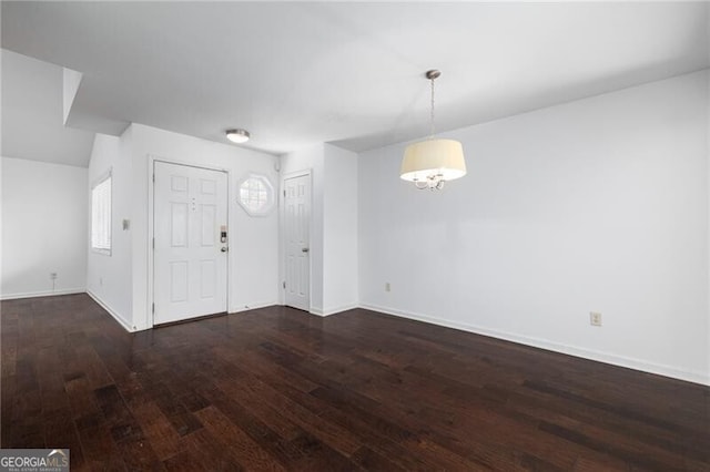 entrance foyer with dark hardwood / wood-style flooring