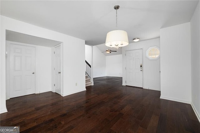 interior space featuring dark hardwood / wood-style flooring and ceiling fan