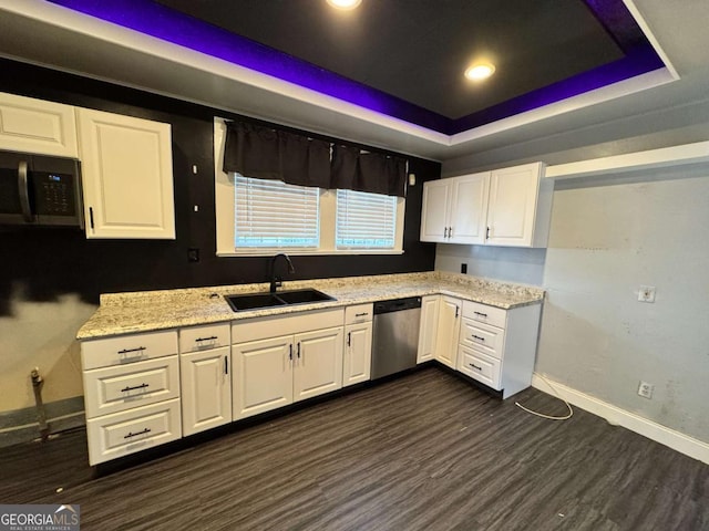 kitchen featuring white cabinetry, sink, stainless steel appliances, a raised ceiling, and dark hardwood / wood-style flooring