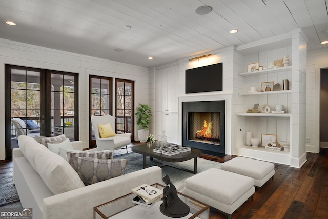 living room with dark hardwood / wood-style flooring, wood ceiling, and french doors