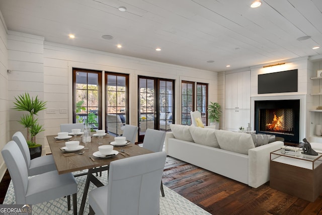 living room with wood walls, wood ceiling, and dark hardwood / wood-style floors