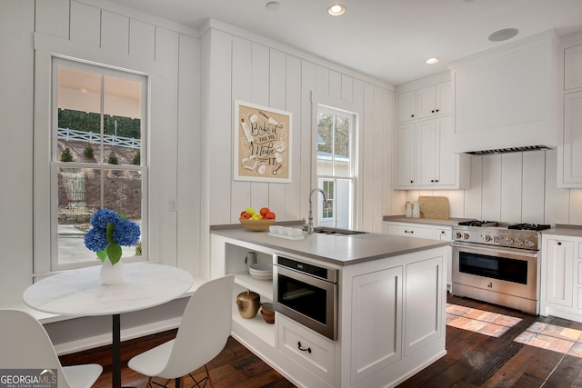 kitchen featuring high end range and white cabinets