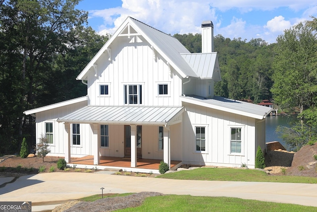 modern inspired farmhouse featuring covered porch