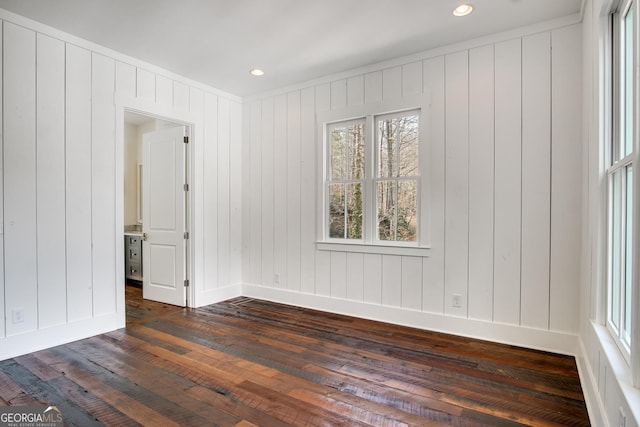 spare room featuring dark hardwood / wood-style floors