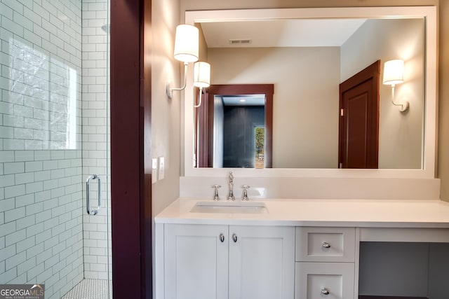 bathroom with vanity and an enclosed shower