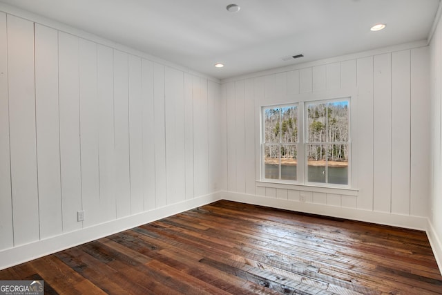 empty room featuring dark hardwood / wood-style floors