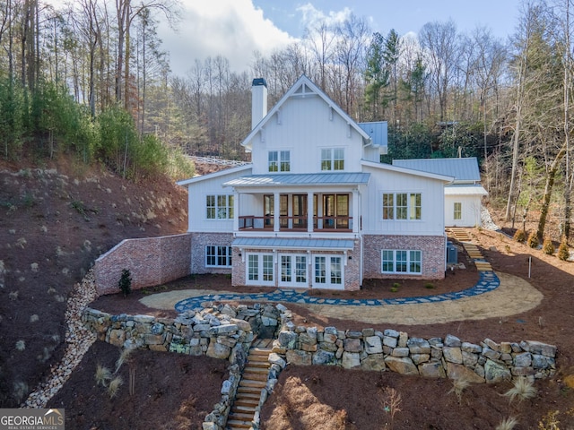 back of house featuring french doors