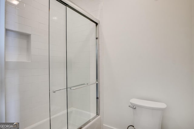 bathroom with toilet and enclosed tub / shower combo