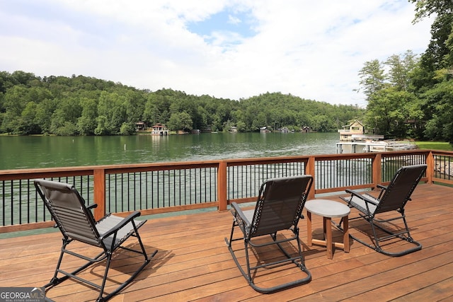 wooden terrace with a water view