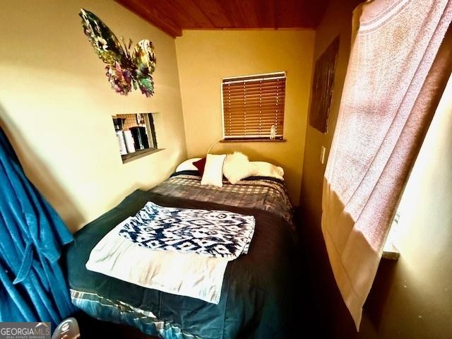 bedroom with wood ceiling