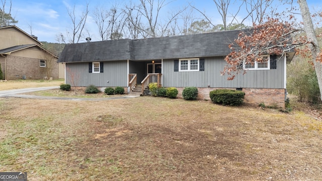 ranch-style house with a front lawn