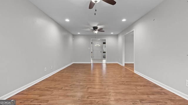 unfurnished room featuring ceiling fan and light hardwood / wood-style flooring