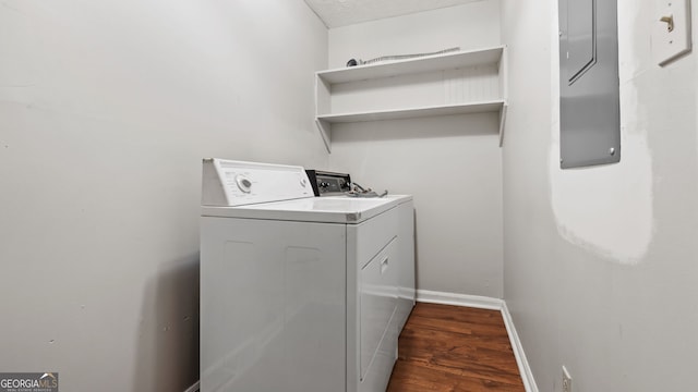 clothes washing area with a textured ceiling, dark hardwood / wood-style floors, and washing machine and dryer