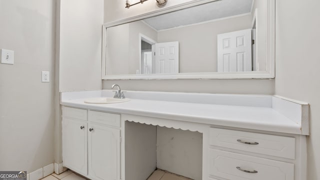 bathroom featuring tile patterned flooring and vanity